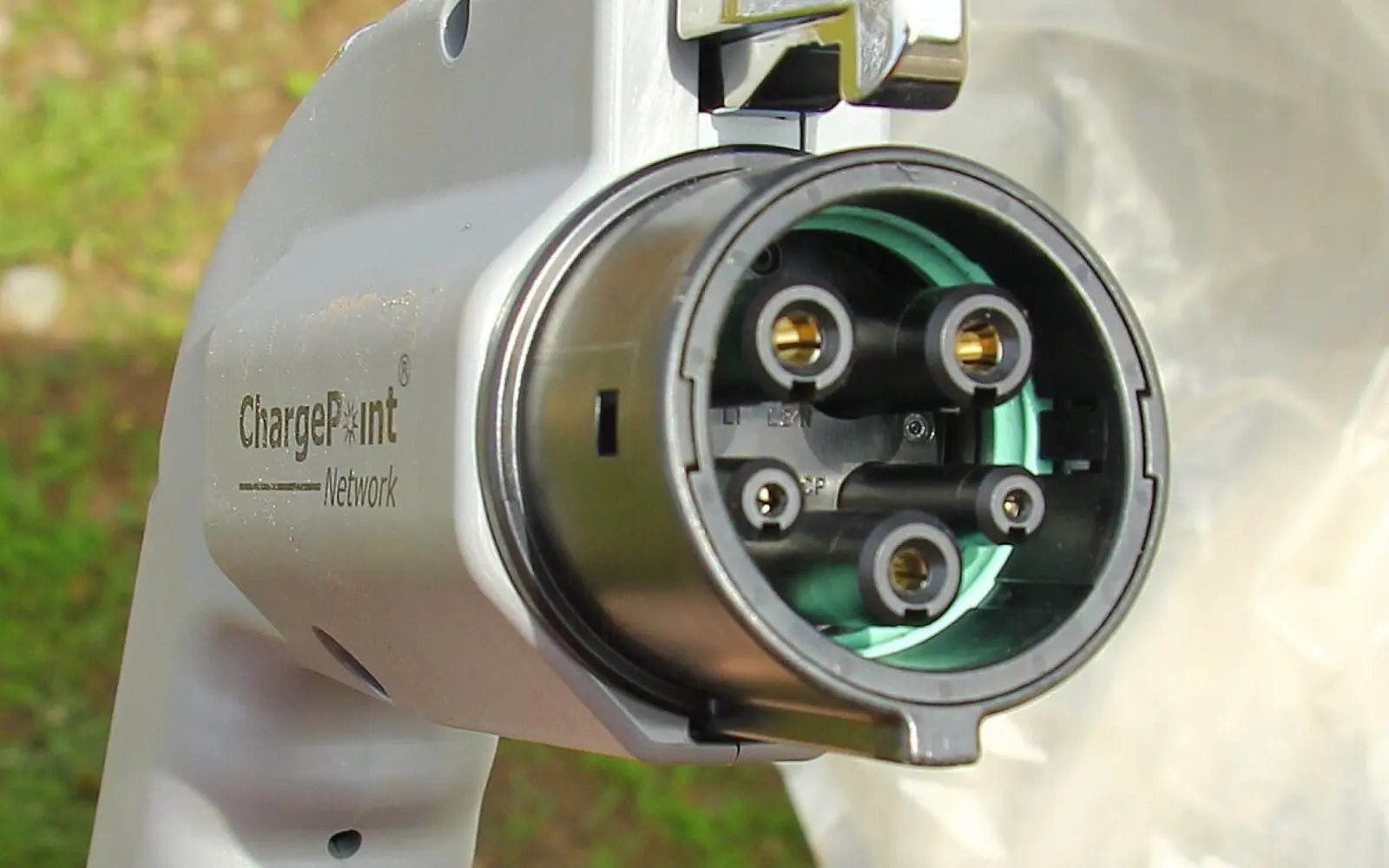 A SAE J1772 (Type 1) electric vehicle charging connector.